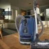 Miele Complete C3 Petrol Blue Vacuum in a modern living room setting