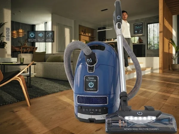 Miele Complete C3 Petrol Blue Vacuum in a modern living room setting